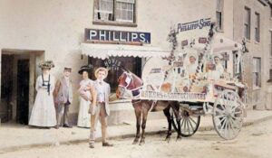 Picture of the PHILLIPS FAMILY BAKERY with a parade float outside, Tetbury, early 20th Century